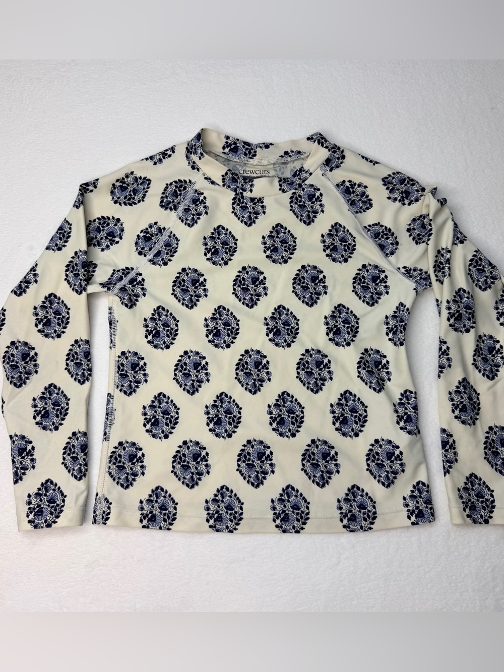 J.Crew long-sleeve rash guard featuring an all-over navy and white floral 6-7